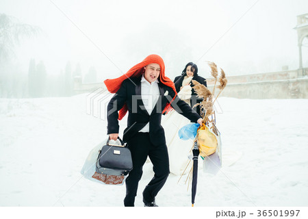 The cheerful groom with the knitted scarf on his 36501997
