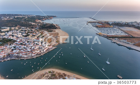 Aerial. Ferragudo at sunset shooting from the sky 36503773