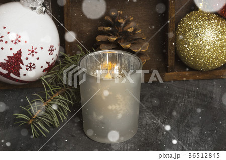 Burning candle in candlestick Christmas attributes 36512845