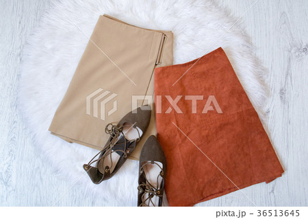 Brown and beige suede skirt, brown shoes. Brown and beige suede skirt, brown shoes. 36513645