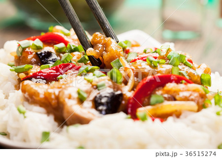 Sirloins on sweet and sour sauce served with rice 36515274