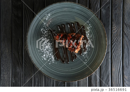 Piece of puffy chocolate cake and souffle 36516691