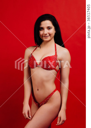 beautiful young girl fitness model stands on red 36517405