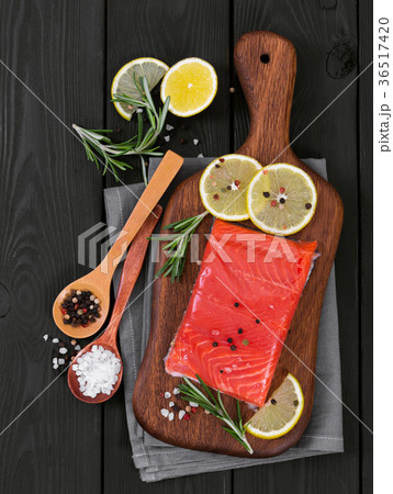 Fillet of salmon on cutting board 36517420