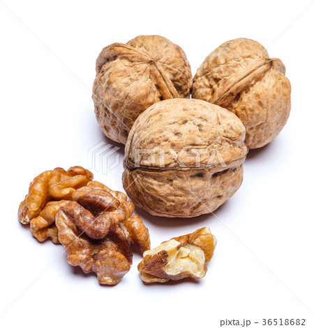 three whole walnuts isolated on white background three whole walnuts isolated on white background 36518682