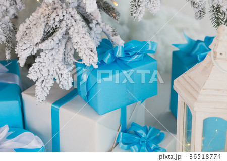 Holiday presents in white and blue wrapping paper Holiday presents in white and blue wrapping paper 36518774