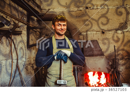 the blacksmith is at the forge 36527103