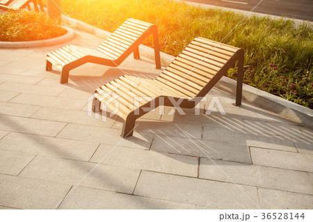 Sun loungers on the public park in the street Sun loungers on the public park in the street 36528144