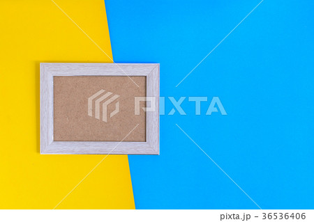 Photo wood frame on colorful paper wall background 36536406
