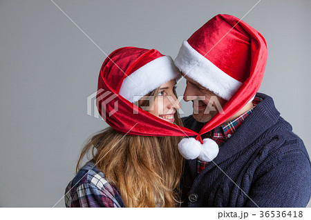 Happy couple in Santa hats 36536418