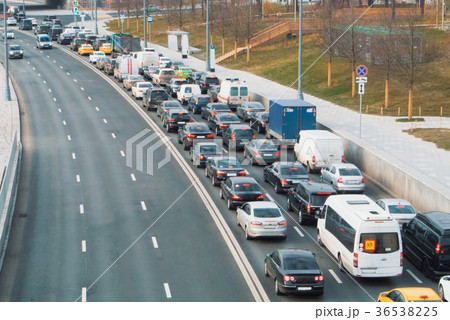 A view to a road with plenty of cars standing A view to a road with plenty of cars standing 36538225