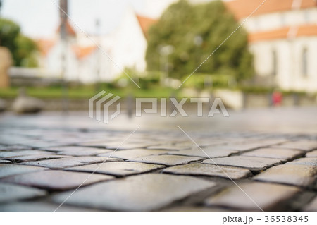 low angle shot of wet old pavement in Tallinn 36538345