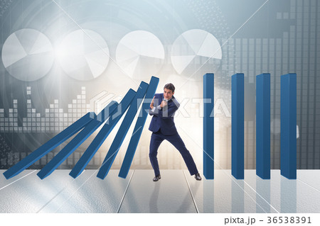 Businessman in domino effect business concept Businessman in domino effect business concept 36538391