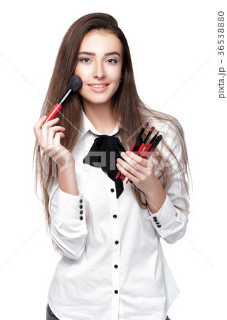 make-up artist holding makeup brush make-up artist holding makeup brush 36538880