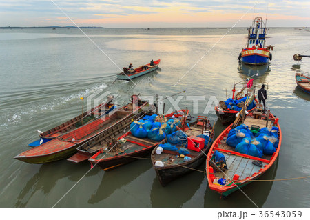 Fishing boats in harbor with sunrise Fishing boats in harbor with sunrise 36543059