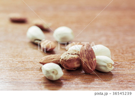 almonds on wooden floor. 36545239