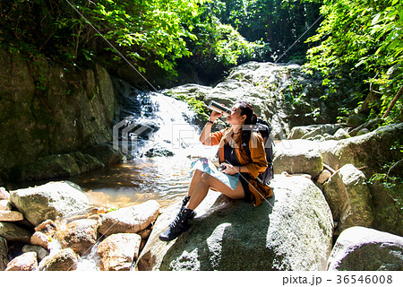 Hiker asia woman drinking water 36546008