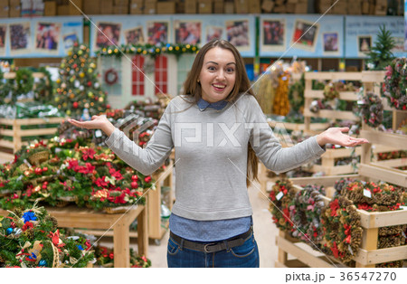 customer girl choosing gifts for Christmas and New 36547270