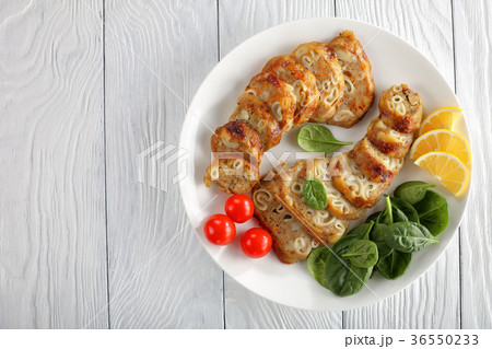 stuffed chicken boneless drumsticks on plate 36550233