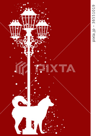 Christmas Dog And Street Light Among Flying Snowのイラスト素材