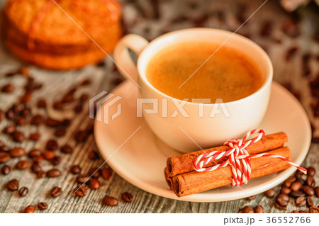 Cozy winter setting with cup of coffee Cozy winter setting with cup of coffee 36552766