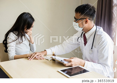 doctor touching patient hand to cheer up 36553919