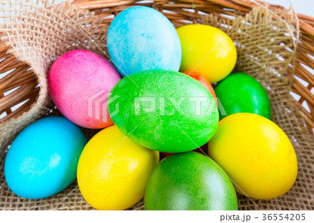 Colored decorated Easter eggs in basket 36554205