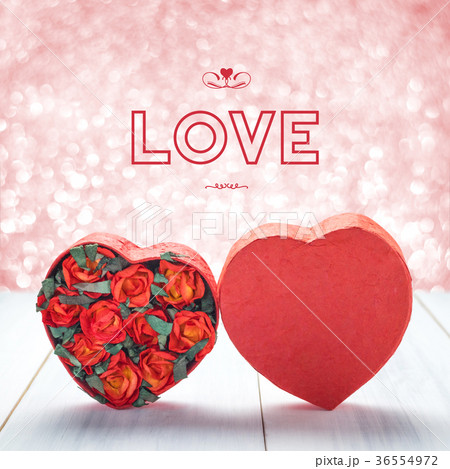 Love with Heart shape with red roses on table Love with Heart shape with red roses on table 36554972