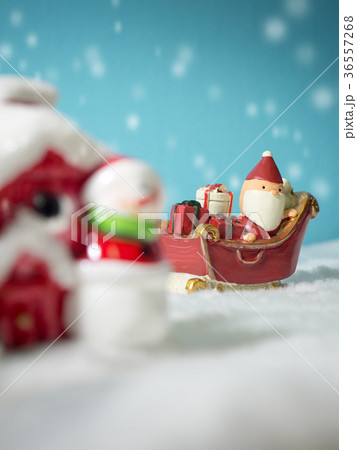 Happy Santa Claus with gifts box on the snow sled Happy Santa Claus with gifts box on the snow sled 36557268