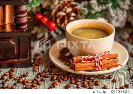 Cozy winter setting with cup of coffee Cozy winter setting with cup of coffee 36557326