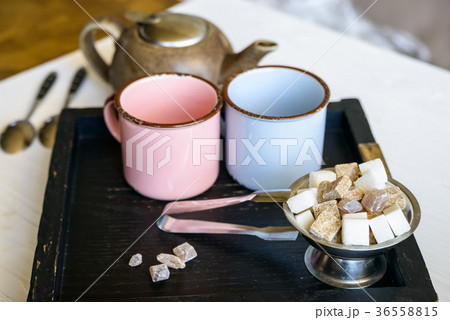 Teaset with two metal cups, sugar tongs and kettle Teaset with two metal cups, sugar tongs and kettle 36558815