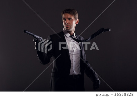 Image of mafia man with emerging tie in leather 36558828