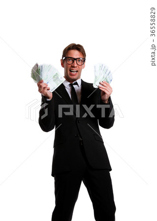 Picture of businessman in suit with money at hands Picture of businessman in suit with money at hands 36558829