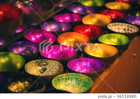 Coconut shell bowls on the wooden shelf 36558980