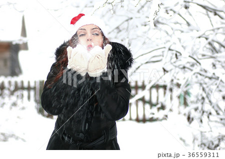 Beautiful girl in winter snowy day Beautiful girl in winter snowy day 36559311