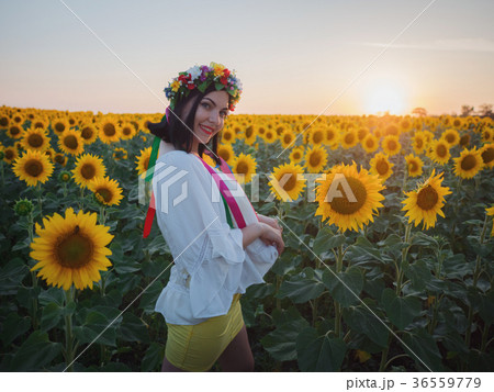 Ukrainian girl in flower field cheerful and joyful 36559779