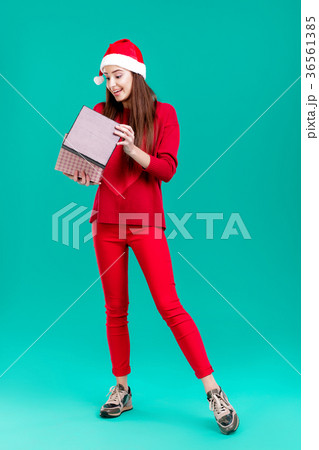 woman in red sweater and christmas hat woman in red sweater and christmas hat 36561385