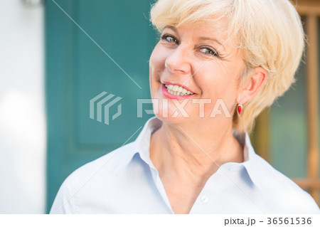 Close-up portrait of a cheerful senior woman with Close-up portrait of a cheerful senior woman with 36561536