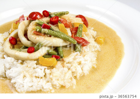 Squid rings in chilli curry sauce served with rice 36563754