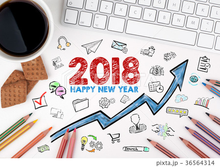 2018 Happy new year, Business Concept. Computer keyboard and cup of coffee on a white table 2018 Happy new year, Business Concept. Computer keyboard and cup of coffee on a white table 36564314