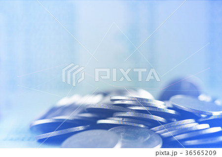 piles of coins and account book or credit card 36565209