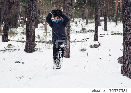 Young boy having fun with snow in the mountain Young boy having fun with snow in the mountain 36577581