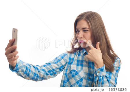 Smiling woman making selfie photo on smartphone Smiling woman making selfie photo on smartphone 36578826