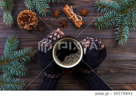 Woman hands holding coffee mug 36579843