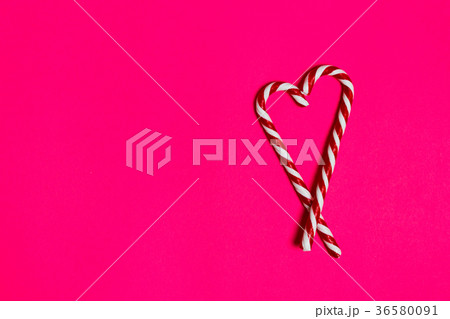 christmas candy heart on pink background 36580091