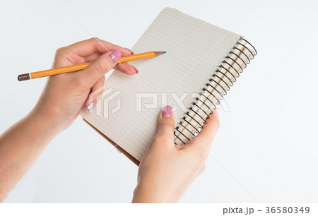 closeup view of hands with sketchbook and pencil 36580349