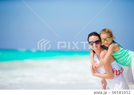 Little adorable girl and young mother at tropical Little adorable girl and young mother at tropical 36581052