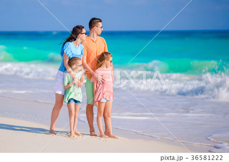 Beautiful family have a lot of fun on the beach Beautiful family have a lot of fun on the beach 36581222