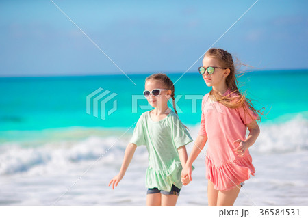 Kids enjoy their holidays on the beach Kids enjoy their holidays on the beach 36584531