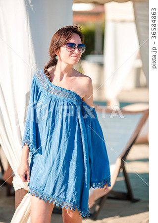 Young woman on the beach. Fashion girl in white 36584863